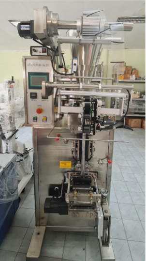เครื่องบรรจุแนวตั้งอัตโนมัติ รุ่น K100 ซีลกลาง ตัดตรง